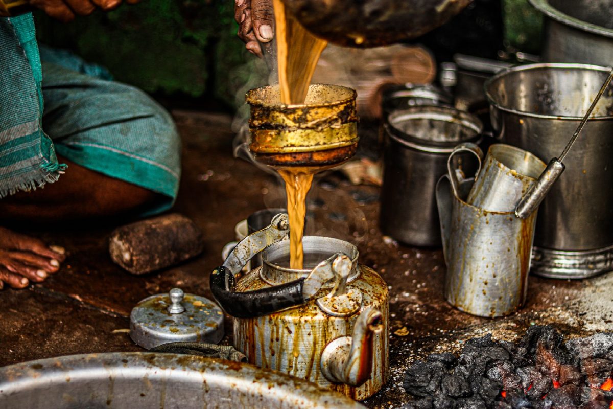 Steam rising from a chai stall in the morning light
